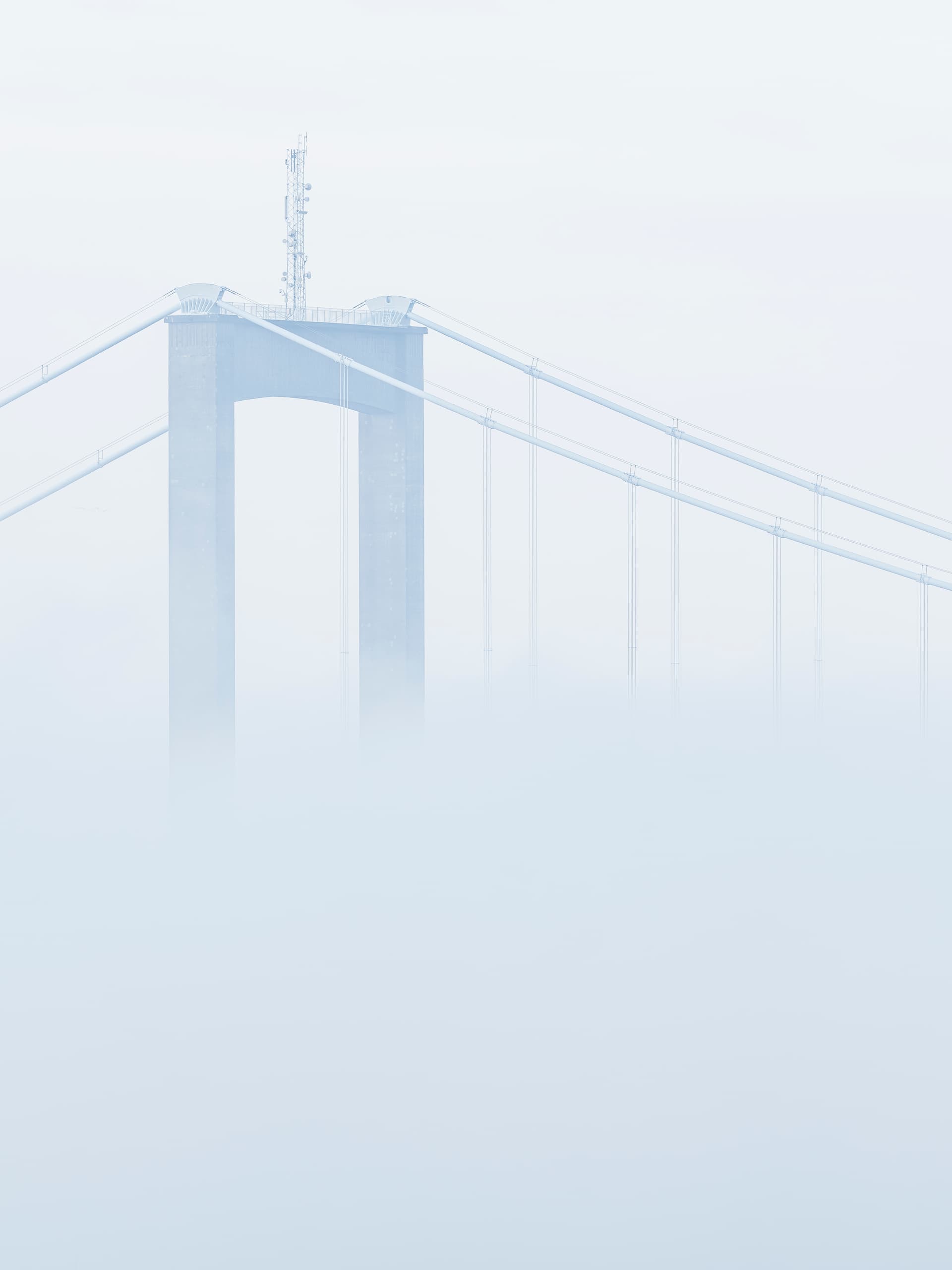 Suspension bridge against clear sky representing connection and wellness journey